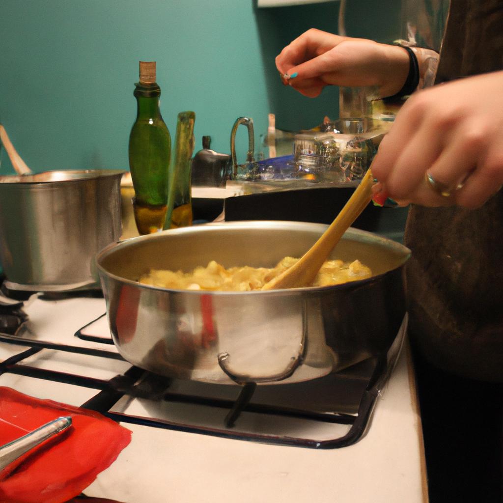 Person Cooking Pasta In Kitchen